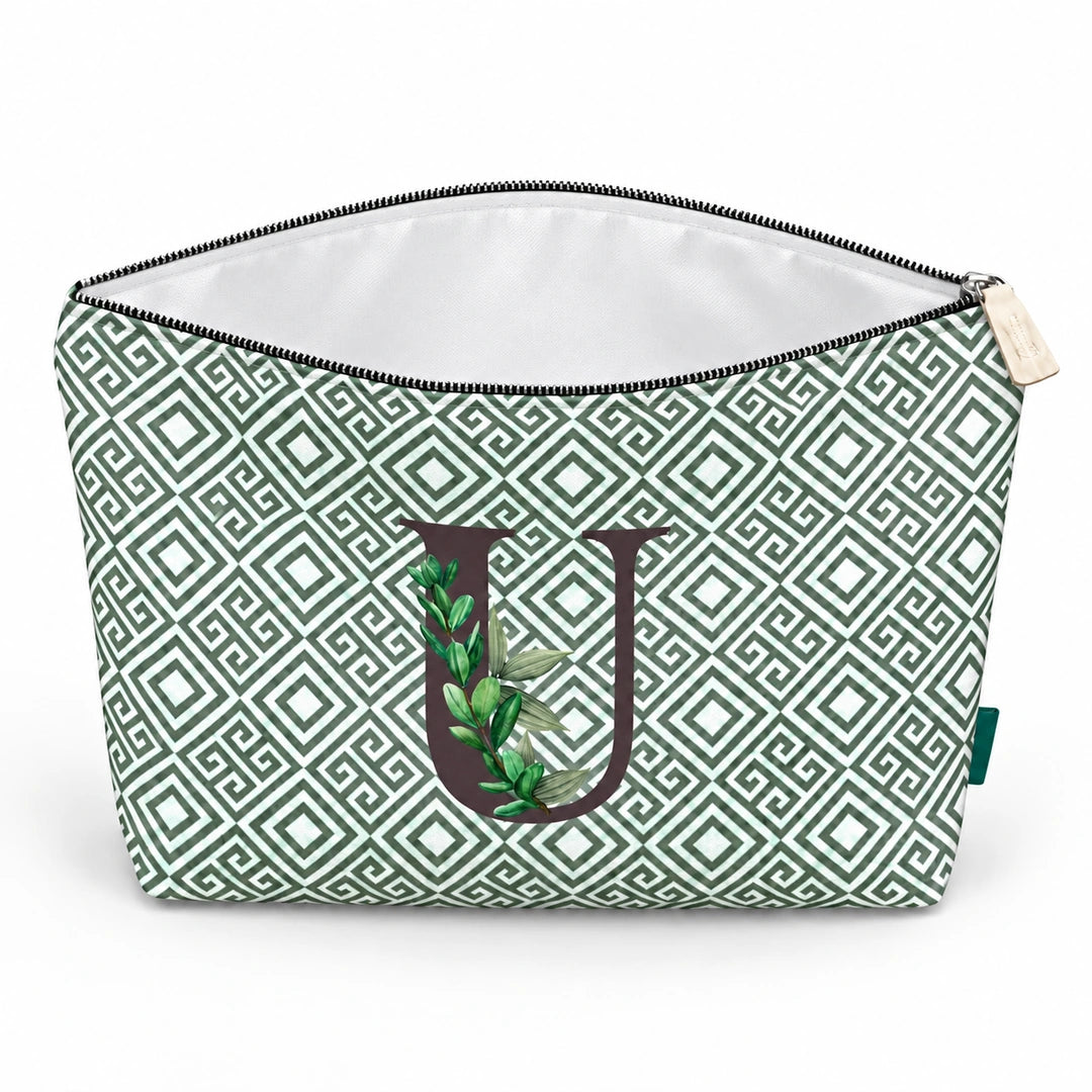 Bolsa Guta verde letra U aberta e vazia, com interior branco, sem forro e sem divisórias.