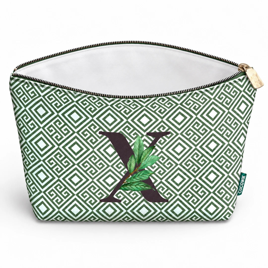 Bolsa Guta verde letra X — aberta e vazia, interior branco sem forro e sem divisórias.