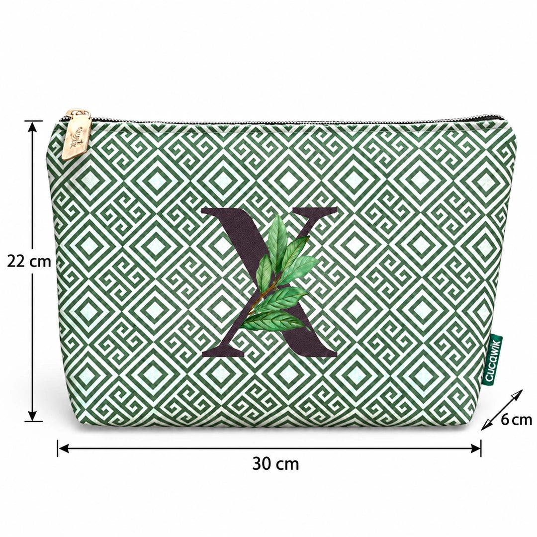 Bolsa Guta verde letra X — medidas 30 × 22 × 6 cm.