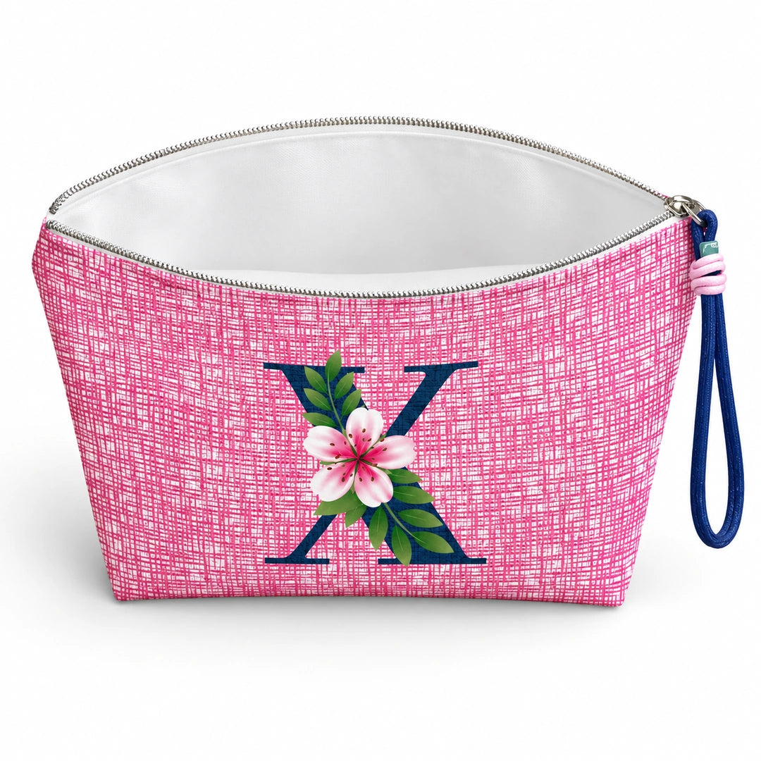 Bolsa Vera rosa letra X — aberta e vazia, interior branco sem forro e sem divisórias.