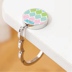 Gancho de Mala Dobrável para Mesa Ikat Pastel Rosa Verde Azul | Cucawik